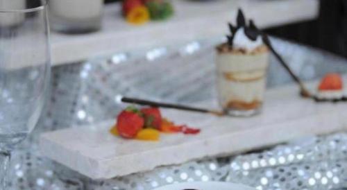 a white plate with a dessert on a table at Patra Cirebon Hotel & Convention in Cirebon