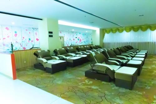 a large room with couches and chairs in it at Ying Feng Yuan Hotel in Guangzhou