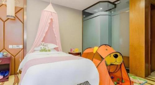 a bedroom with a bed with a backpack on it at VX Hotel Chengdu Jiaolong Port Haibin in Chengdu