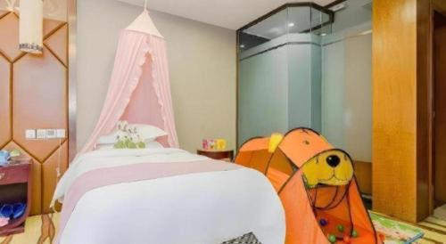 a bedroom with a bed with a backpack on it at VX Hotel Chengdu Jiaolong Port Haibin in Chengdu