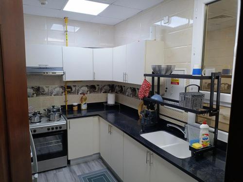 Kuchyň nebo kuchyňský kout v ubytování 2 bedrooms Lusail apartment