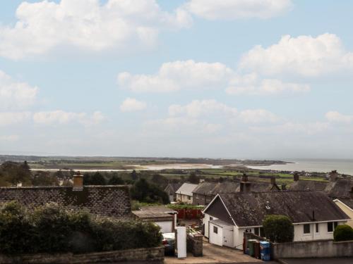 a view of a town with houses and the ocean at Maesawel Studio in Harlech