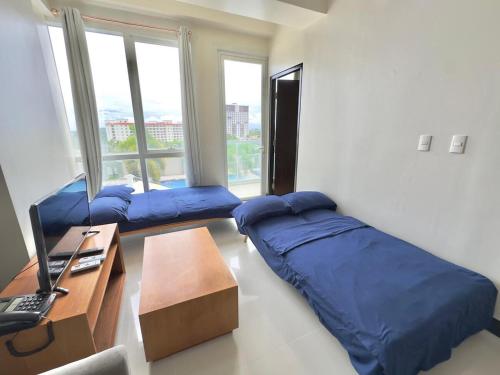 Ένα ή περισσότερα κρεβάτια σε δωμάτιο στο BEACH Condo at The Mactan Newtown for 6 guests