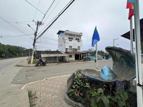 a statue of a fish on the side of a street at Suites San José in San José
