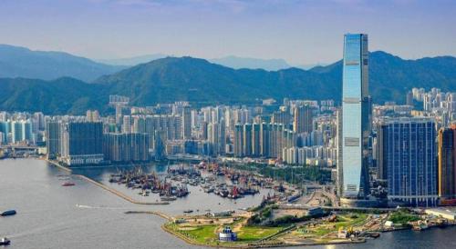 an aerial view of a city with a tall building at Sunny Day Hotel in Hong Kong