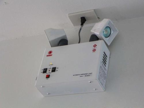 a white box with a speaker on a table at The Grace Residence in Surin