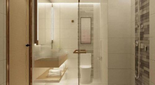 a bathroom with a sink and a glass shower at Lavande Hotel Shenzhen East Gate Wanxiang City Guomao Metro Statipn in Shenzhen