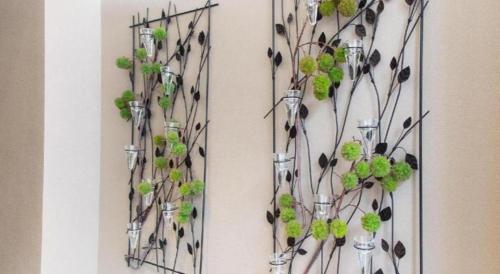 a wall with three vases with plants in them at Metroplace Boutique in Hong Kong