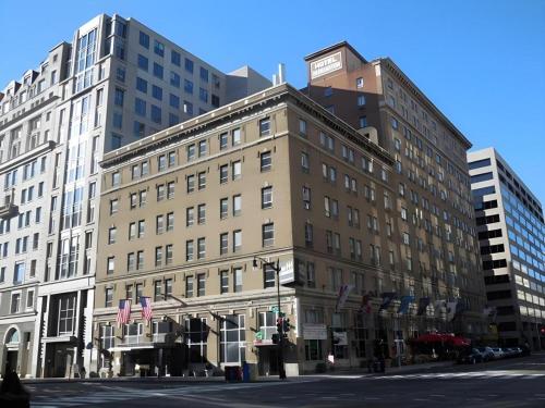 a large building on a city street with buildings at Hotel Harrington in Washington