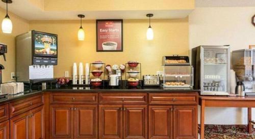 a coffee shop with a counter with many items on it at Econo Lodge Near Quantico Marine Base in Dumfries