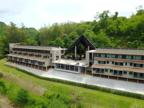 an overhead view of a large building with trees at River Kwai Village Hotel in Ban Kaeng Raboet