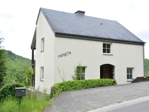 a white building with the word yarra written on it at Hill View Apartment in Bouillon with Terrace in Bouillon