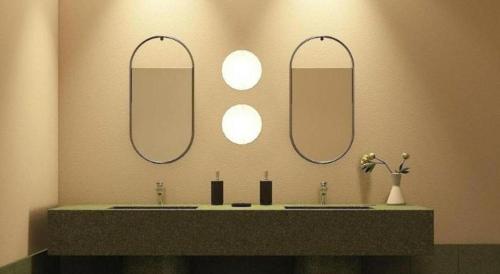 a bathroom with three sinks with mirrors on the wall at 777Bliss Hometel in Nakhon Phanom