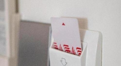 a white wii controller with a red triangle on it at 777Bliss Hometel in Nakhon Phanom