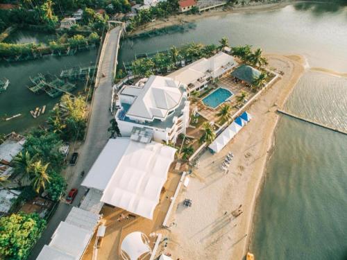 an aerial view of a house on the water at Vitalis White Sands in Vigan