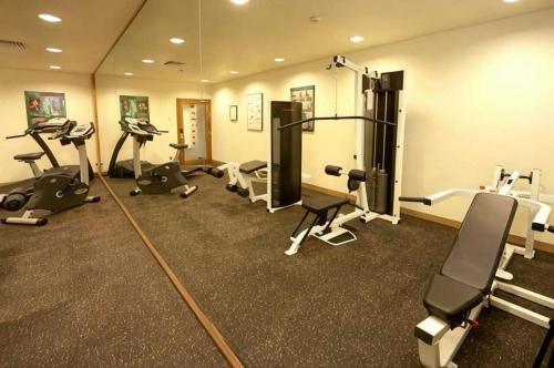 a gym with several exercise equipment in a room at Hotel Miramar Singapore in Singapore