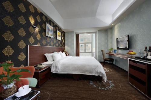 Ein Bett oder Betten in einem Zimmer der Unterkunft Shenzhen Hanyong Hotel Fuyong Branch