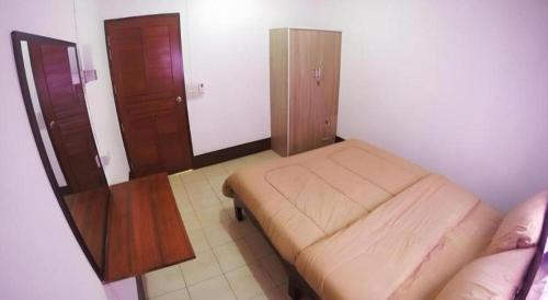 Ένα ή περισσότερα κρεβάτια σε δωμάτιο στο BAANKONPAI