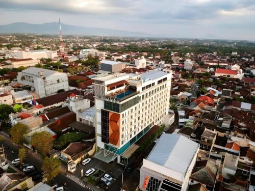 an aerial view of a city with buildings at Java Lotus Hotel Jember in Jember
