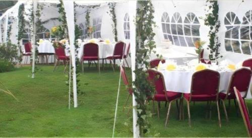 a group of tables and chairs in a marquee at HOTEL STAR 39 in Ho Chi Minh City