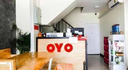 a kitchen with an omo sign on a counter at 5BOX Donmuang Airport in Bangkok