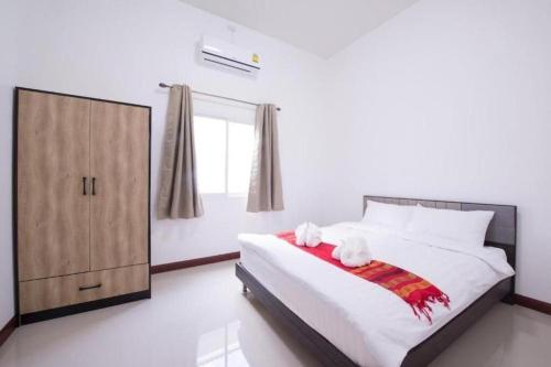 Un ou plusieurs lits dans un hébergement de l'établissement Bees Smile Hotel
