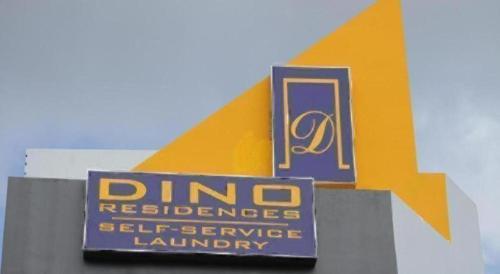 Un certificado, premio, letrero u otro documento en Dino Residences