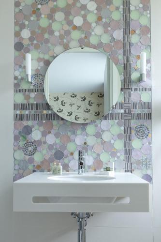 a bathroom with a white sink and a mirror at Hôtel Aiglon in Paris