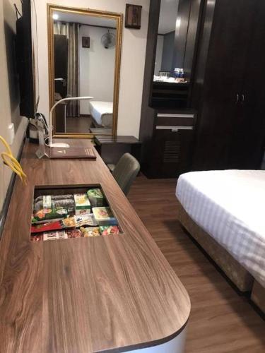 a hotel room with a table with food on it at New Moon Hotel in Hanoi