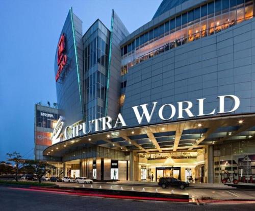 a building with a sign that reads capita world at The Day Residence in Jakarta