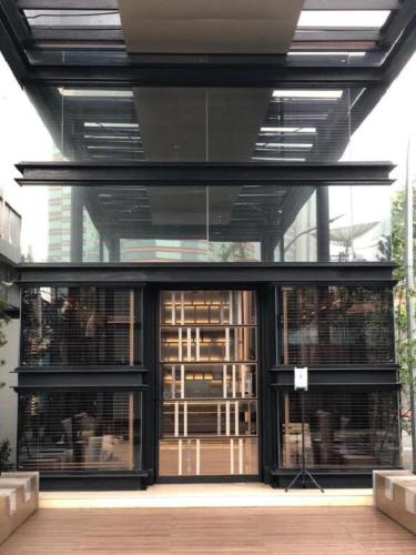 a building with glass doors and windows in a building at The Day Residence in Jakarta