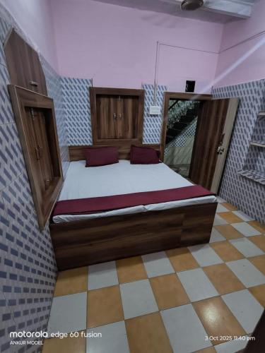 a bedroom with a large bed in a room at Annu Bhai Sewa Sadan in Mathura