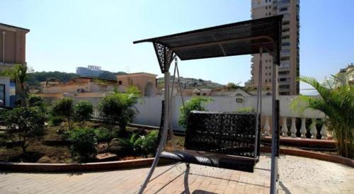 a chair sitting on top of a balcony at GreenTree Inn Fuzhou Gulou District West Xierhuan Road Zuohai Park in Fuzhou