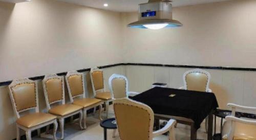 a conference room with a table and chairs at Vienna 3 Best Shanghai Baoshan Fengxiang Road in Shanghai
