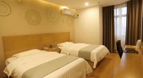 Katil atau katil-katil dalam bilik di GreenTree Inn Hefei Huaxia International Chabocheng Branch