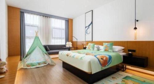 a bedroom with a bed and a play tent at Fairfield by Marriott Baoding High-Tech Zone in Baoding
