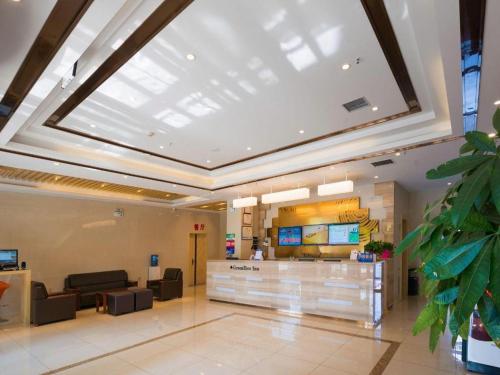 a large lobby with a large skylight in a building at GreenTree Inn Qinhuangdao Changli County Guangyuan Life Square Duanyang Street East Section in Qinhuangdao