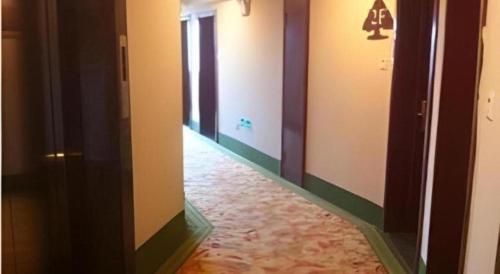 a hallway of a room with at GreenTree Inn Jiaxing Tongxiang Tudian Express Hotel in Jiaxing