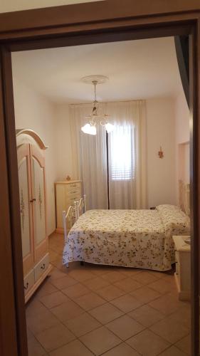 a bedroom with a bed and a window at Villa Malandrino Guest House in Agropoli
