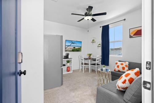 a living room with a couch and a ceiling fan at Luxury 1BR Suite Bakersfield California in Bakersfield