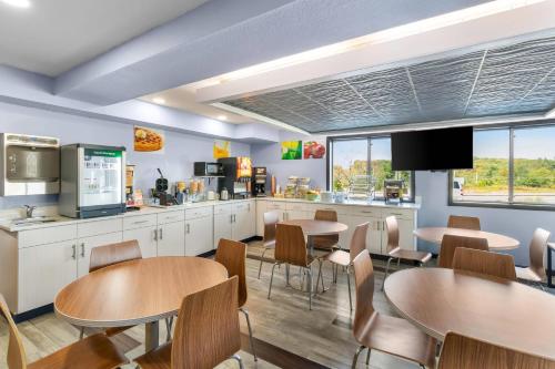 a fast food restaurant with tables and chairs at Quality Inn in Johnstown