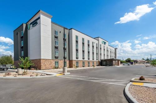 an empty parking lot in front of a building at WoodSpring Suites Tucson Medical Center in Tucson