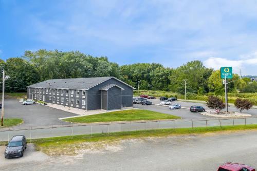 an aerial view of a parking lot with a building at Quality Inn in West Haven