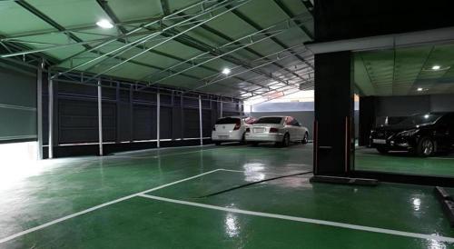 a garage with two cars parked in it at Java Hotel in Daejeon