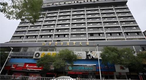 a large building with a lot of windows at City Comfort Inn Zhaoqing Qixingyan Scenic Area Xinghu Archway in Zhaoqing