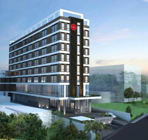 a rendering of a building with a clock on it at Hotel Grandhika Pemuda in Semarang