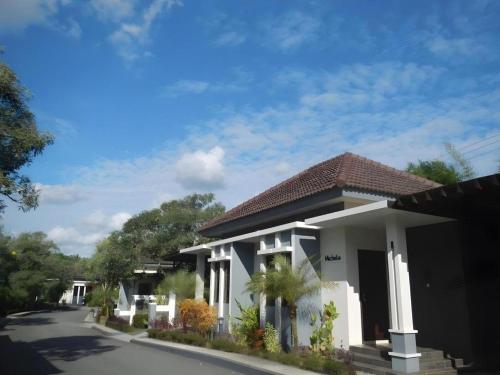 a rendering of a house on a street at The Luxio Hotel in Sorong