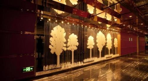 a fence with lights on it in a building at Changchun Zhuozhan Days Hotel in Changchun
