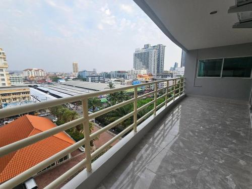 a balcony with a view of the city at View Talay6 by Blue Ocean Suite in Pattaya Central
