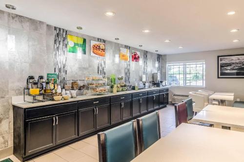 a kitchen with a counter with food on it at Quality Inn & Suites Westminster - Broomfield in Westminster